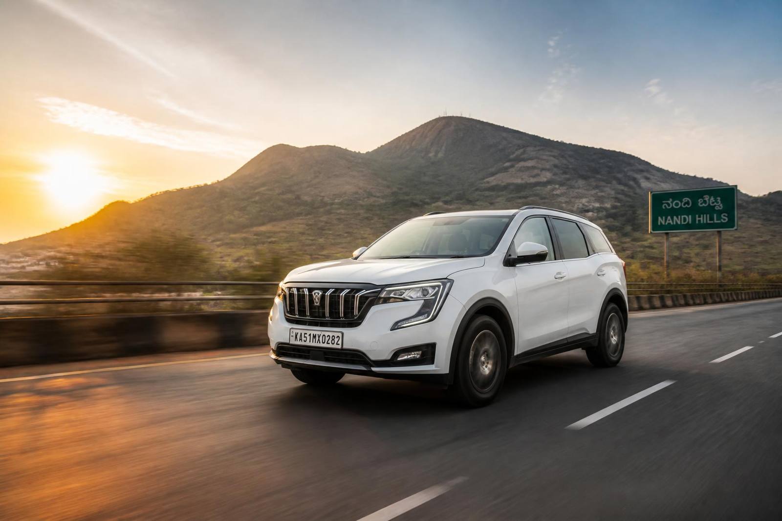 SUV driving near Nandi Hills outside Bangalore at sunrise